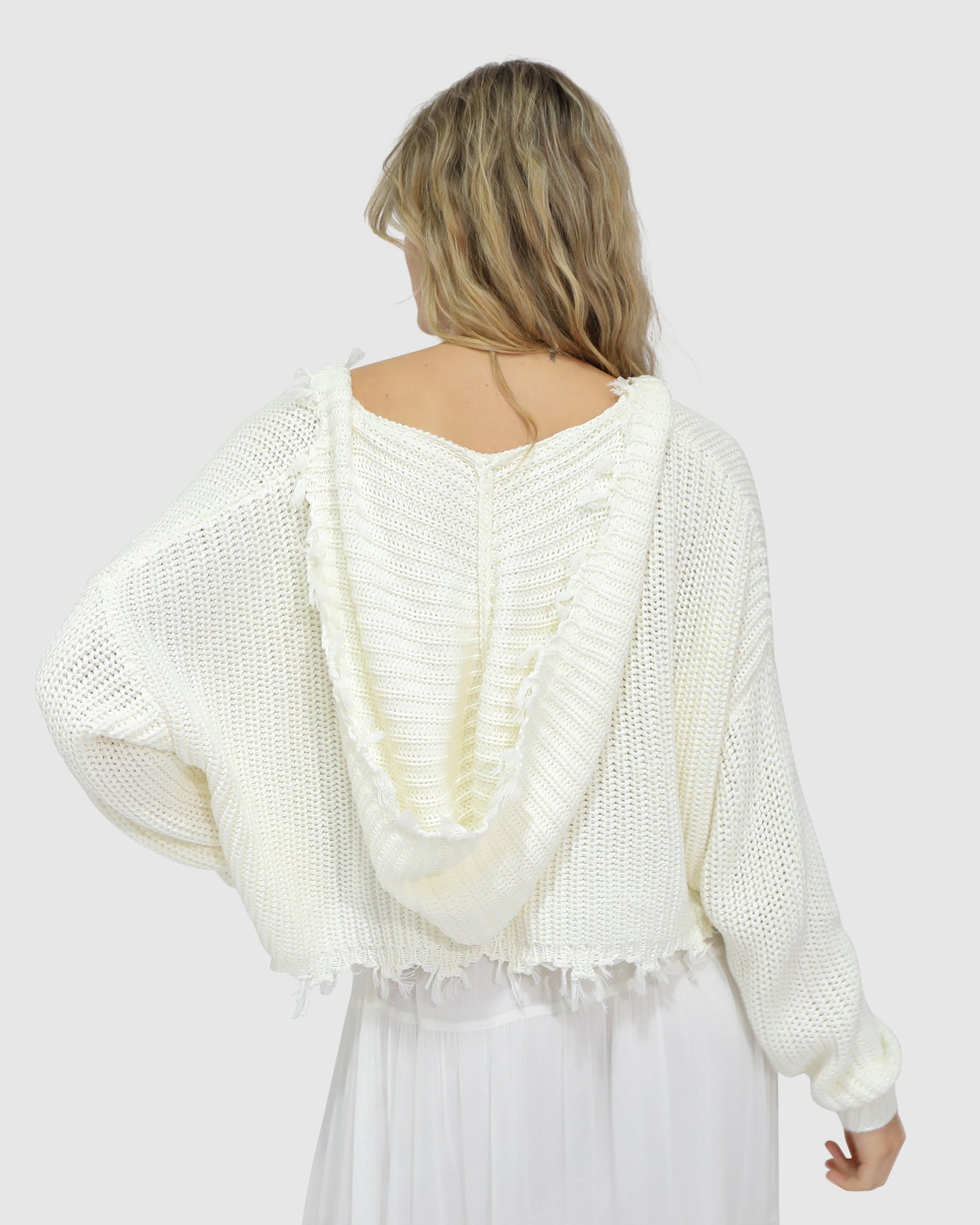 Back view of the Another Love Fringe Knit Zip Cardigan in cream, showcasing the chunky knit fabric, relaxed fit, and hood detail – Belle and Bloom women's cardigan.