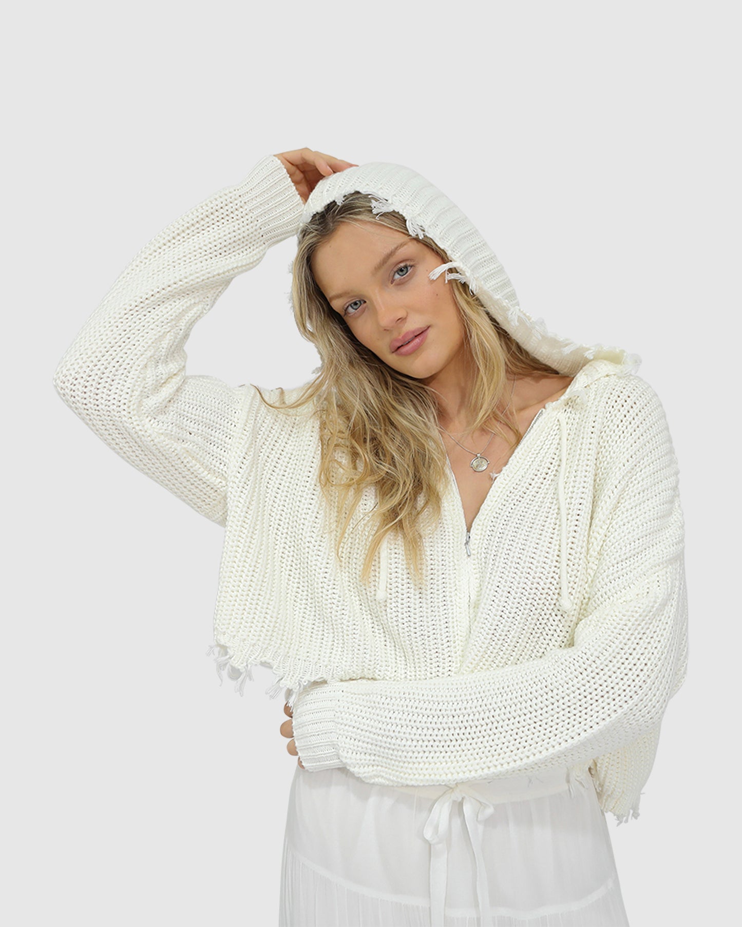 Close-up of the Another Love Fringe Knit Zip Cardigan in cream, showing chunky knit texture, zip closure, and fringe hem detail – Belle and Bloom knitwear.