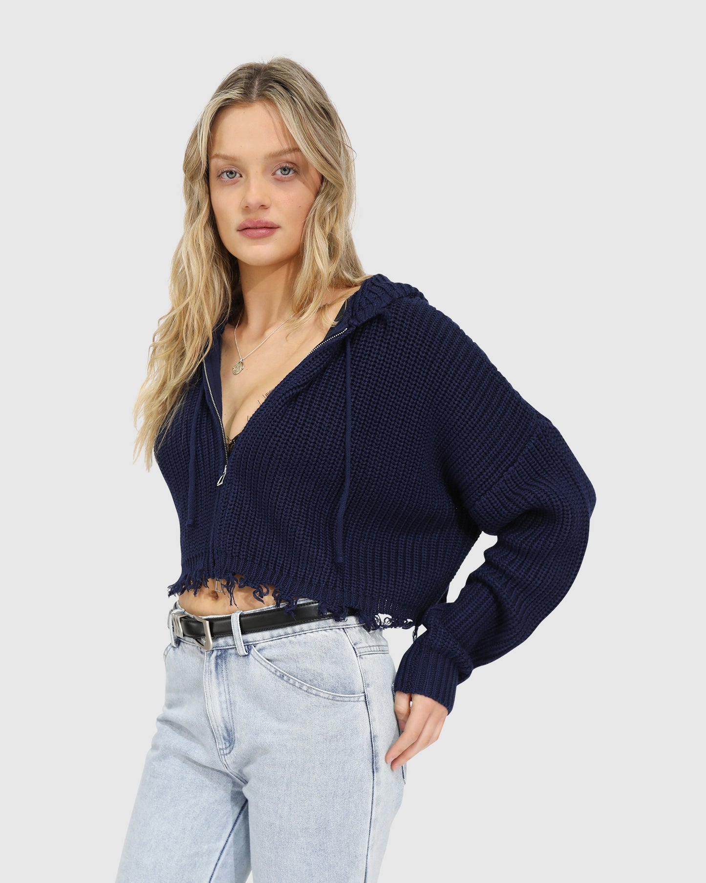 Close-up of the Another Love Fringe Knit Zip Cardigan in navy, showing chunky knit texture, zip closure, and fringe hem detail – Belle and Bloom knitwear.