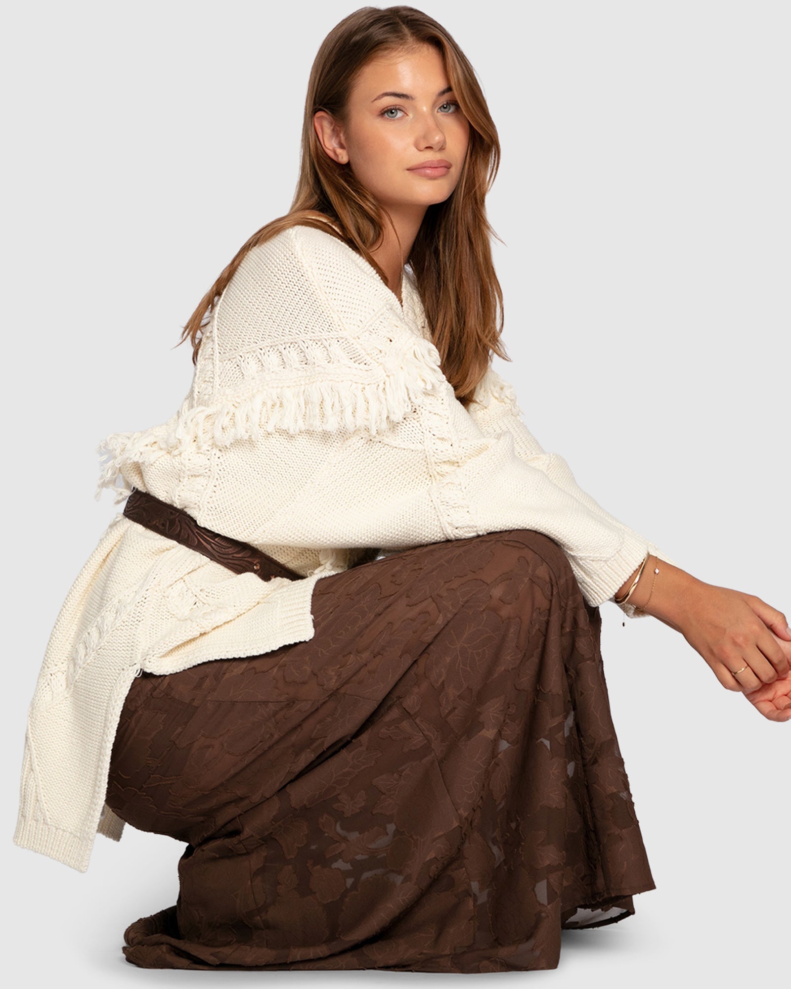 Women's oversized knit sweater with tassel fringe detailing in cream
