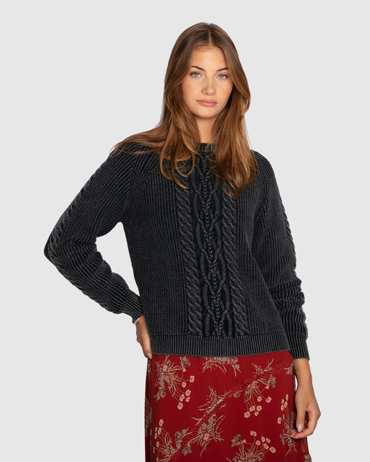 Women's cable knit sweater with garment-dyed finish and relaxed fit in navy
