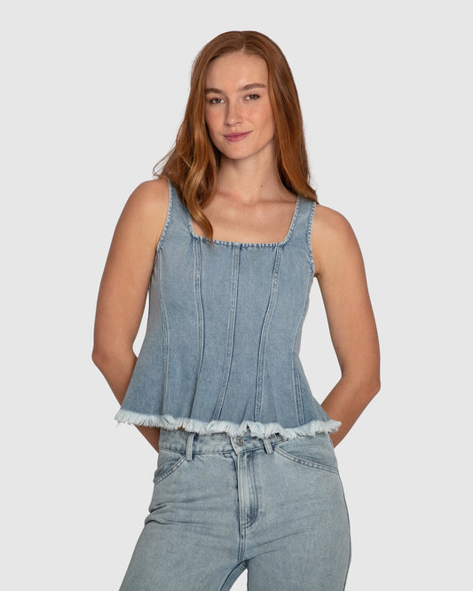Front view of Belle & Bloom Hold Me Brave Fringed Hem Denim Top with square neckline and frayed hem in mid-wash cotton denim.