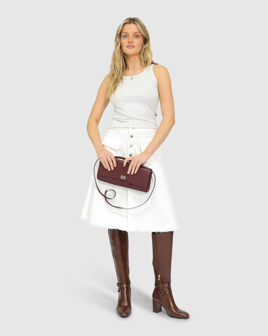 Belle and Bloom Let Me Wander button front denim midi skirt in off white, featuring raw hem and high waist.