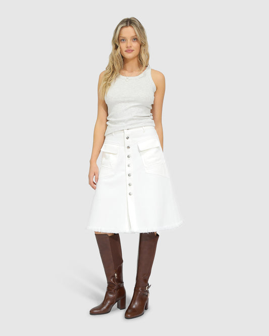 Belle and Bloom Let Me Wander button front denim midi skirt in off white, featuring raw hem and high waist.