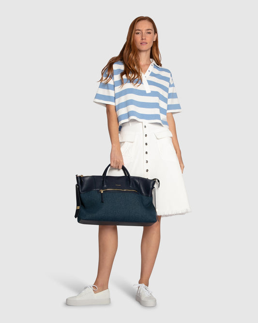 Belle and Bloom Let Me Wander button front denim midi skirt in off white, featuring raw hem and high waist.