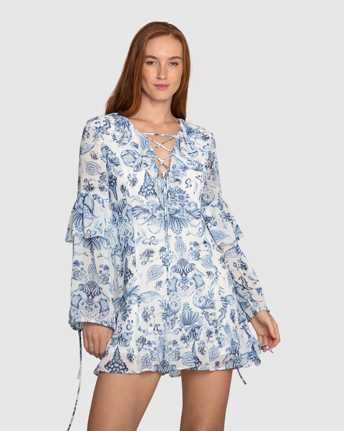 Close-up of fabric texture on Mad About You blue print mini dress by Belle & Bloom, highlighting the lightweight polyester material.