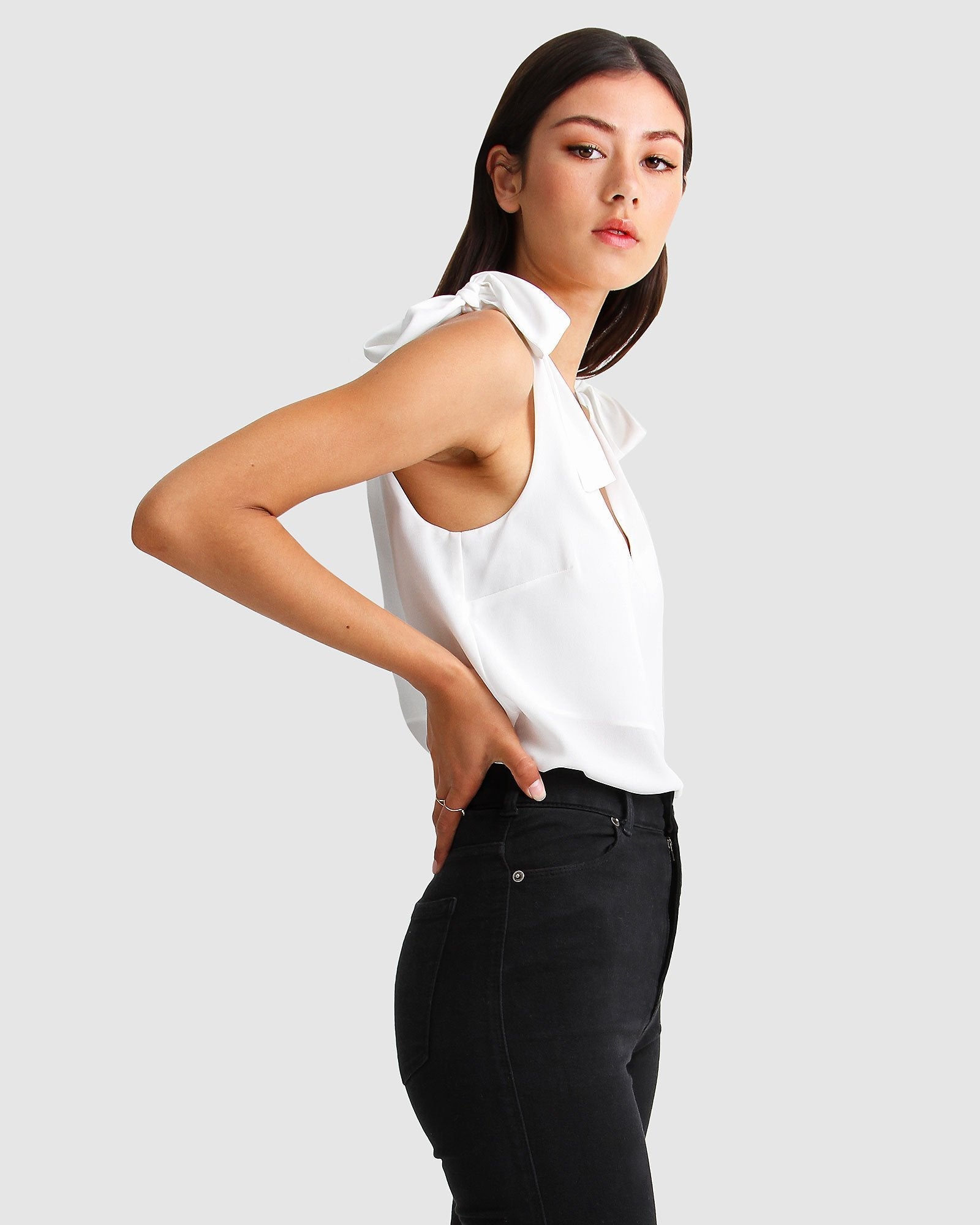feel-for-you-white-v-neck-top-side_394f51be-59a5-4968-9676-54e5b396c3fa.jpg